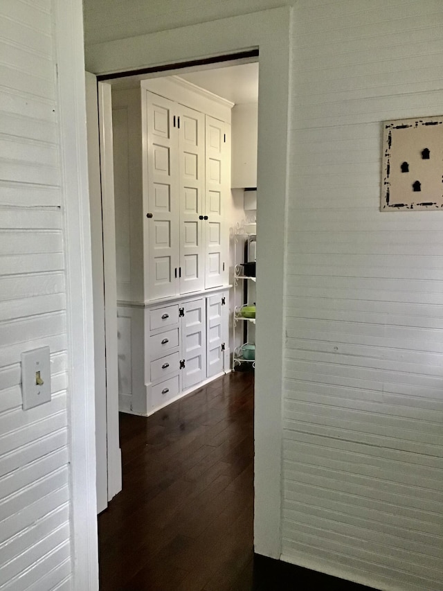 hall with dark wood-style floors