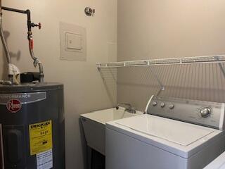 23004 Doremus St Unit 2, Saint Clair Shores, MI 48080 - laundry area with washer / dryer and water heater