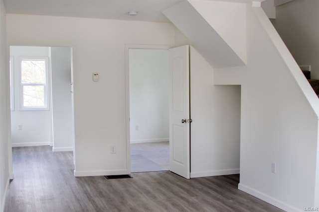 807 N St, Morenci, MI 49256 - bonus room featuring wood finished floors, baseboards, and stairs