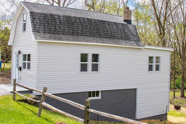 807 N St, Morenci, MI 49256 - view of home's exterior with roof with shingles, a chimney, and an attached garage