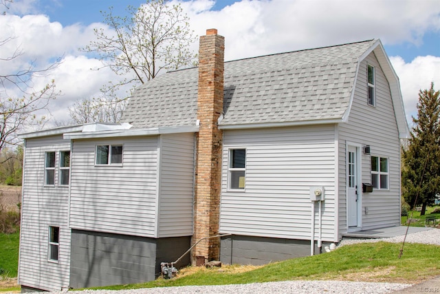 807 N St, Morenci, MI 49256 - view of side of property with roof with shingles and a chimney