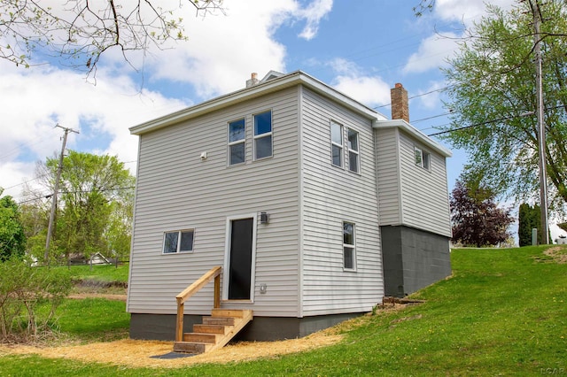 807 N St, Morenci, MI 49256 - back of property with entry steps, a chimney, and a yard