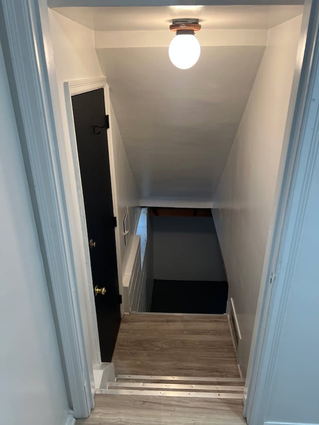stairway with wood finished floors