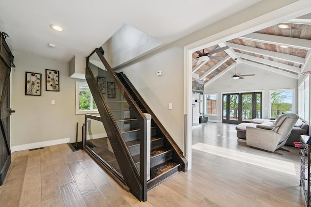 6481 Wardell, West Bloomfield, MI 48324 - staircase featuring baseboards, wood finished floors, a ceiling fan, a barn door, and recessed lighting