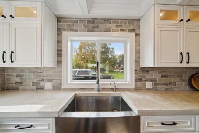 6481 Wardell, West Bloomfield, MI 48324 - kitchen featuring a sink, light countertops, backsplash, and white cabinets