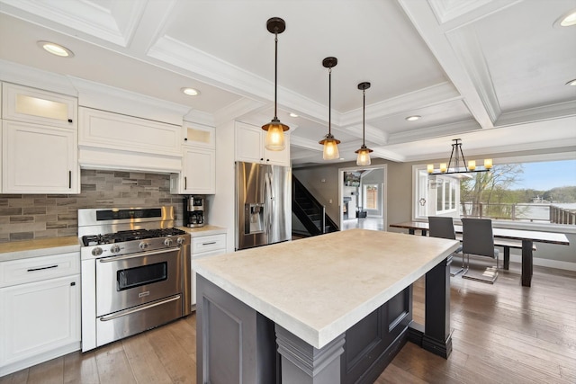 6481 Wardell, West Bloomfield, MI 48324 - kitchen featuring appliances with stainless steel finishes, coffered ceiling, decorative backsplash, light countertops, and ornamental molding