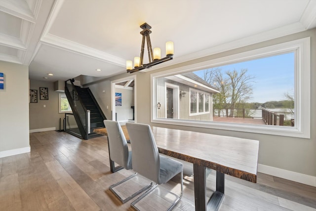 6481 Wardell, West Bloomfield, MI 48324 - unfurnished dining area with a chandelier, crown molding, baseboards, stairs, and wood finished floors