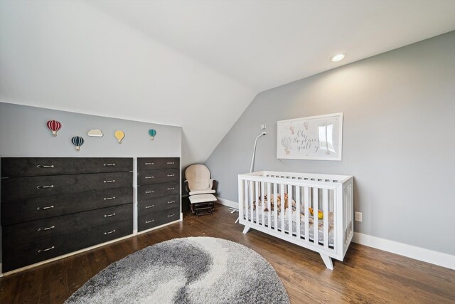 6481 Wardell, West Bloomfield, MI 48324 - bedroom featuring vaulted ceiling, wood finished floors, baseboards, and a nursery area