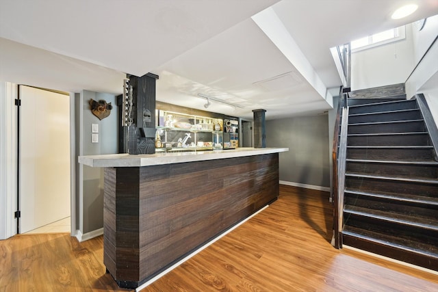 6481 Wardell, West Bloomfield, MI 48324 - indoor dry bar with wood finished floors, stairs, baseboards, and rail lighting