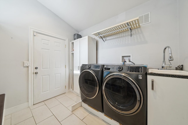 6481 Wardell, West Bloomfield, MI 48324 - laundry area featuring cabinet space, washing machine and dryer, light tile patterned flooring, and baseboards