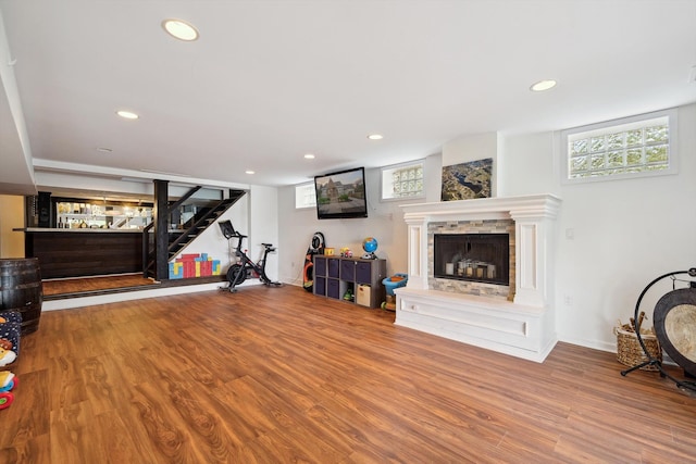 6481 Wardell, West Bloomfield, MI 48324 - workout area with wood finished floors, a fireplace with raised hearth, and recessed lighting