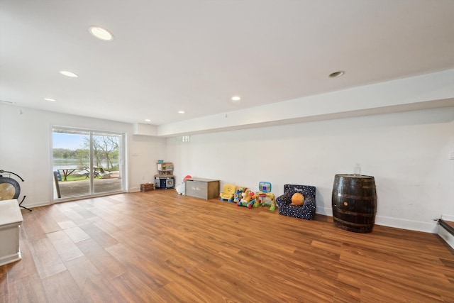 6481 Wardell, West Bloomfield, MI 48324 - playroom featuring wood finished floors, recessed lighting, and baseboards