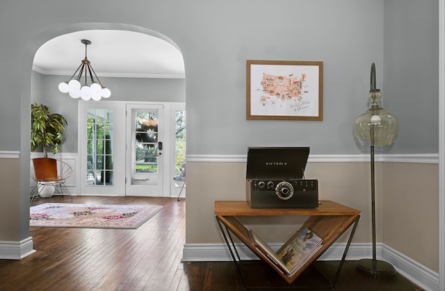 3556 Orchard Lake Rd, Orchard Lake, MI 48324 - doorway to outside with hardwood / wood-style flooring, arched walkways, ornamental molding, and a chandelier
