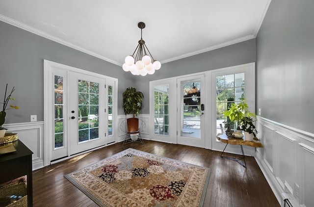 3556 Orchard Lake Rd, Orchard Lake, MI 48324 - entryway with ornamental molding, a chandelier, wainscoting, hardwood / wood-style floors, and a decorative wall