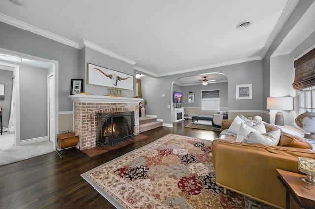 3556 Orchard Lake Rd, Orchard Lake, MI 48324 - living area with arched walkways, a brick fireplace, hardwood / wood-style floors, ornamental molding, and baseboards