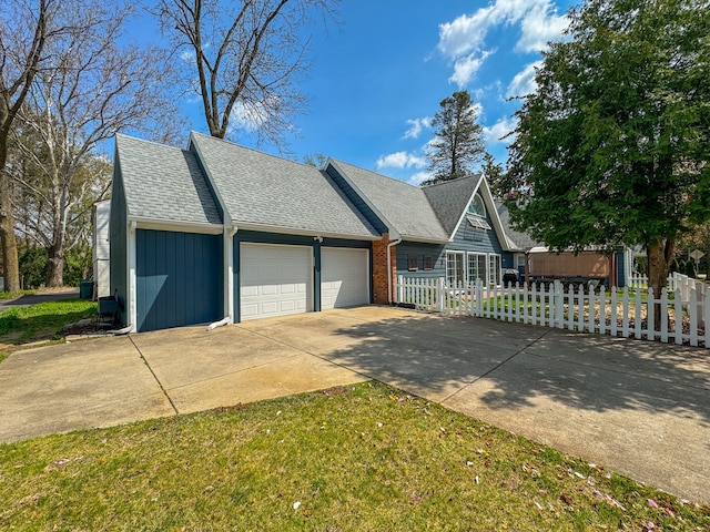 3556 Orchard Lake Rd, Orchard Lake, MI 48324 - view of front of house featuring a garage, driveway, a fenced front yard, roof with shingles, and board and batten siding