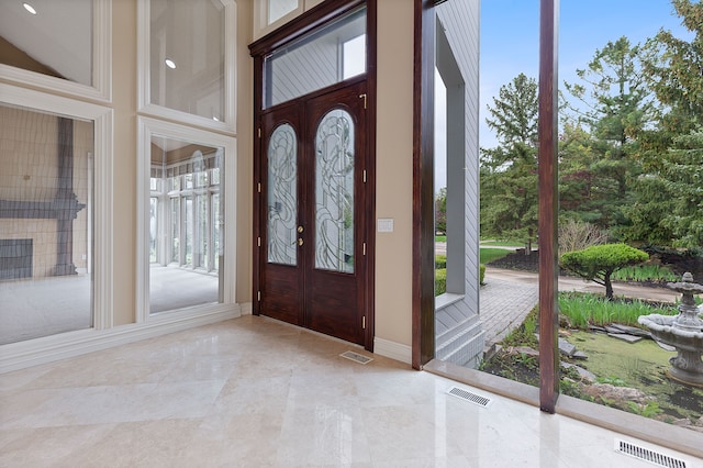 5215 Deer Run Cir, Orchard Lake, MI 48323 - entrance foyer with healthy amount of natural light, baseboards, and light tile patterned flooring