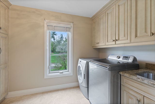 5215 Deer Run Cir, Orchard Lake, MI 48323 - clothes washing area featuring washer and clothes dryer, baseboards, and cabinet space