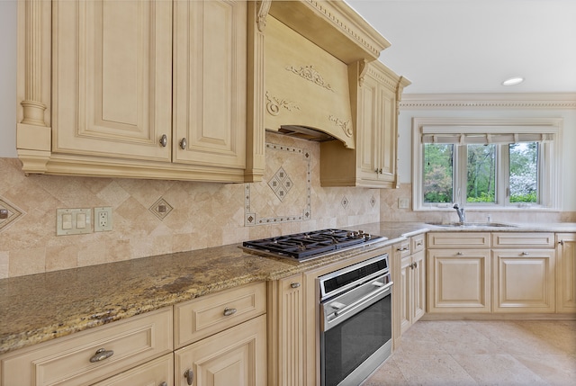 5215 Deer Run Cir, Orchard Lake, MI 48323 - kitchen with appliances with stainless steel finishes, a sink, cream cabinets, light stone countertops, and decorative backsplash