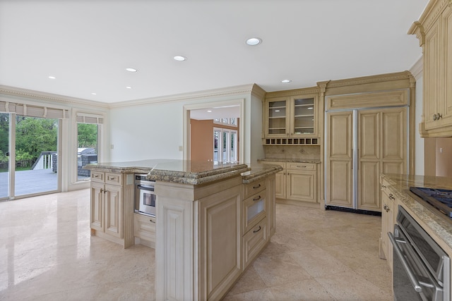 5215 Deer Run Cir, Orchard Lake, MI 48323 - kitchen featuring oven, a center island, cream cabinets, light stone counters, and recessed lighting