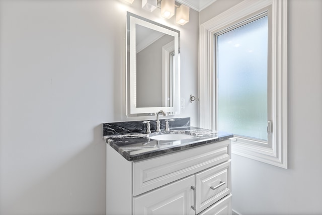 5215 Deer Run Cir, Orchard Lake, MI 48323 - bathroom with healthy amount of natural light, vanity, and ornamental molding