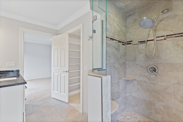 5215 Deer Run Cir, Orchard Lake, MI 48323 - full bathroom featuring tiled shower, ornamental molding, vanity, and a walk in closet