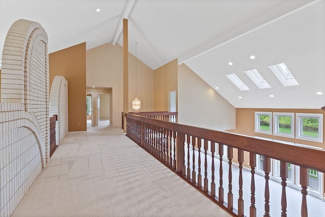 5215 Deer Run Cir, Orchard Lake, MI 48323 - corridor with high vaulted ceiling, a skylight, beamed ceiling, carpet, and recessed lighting