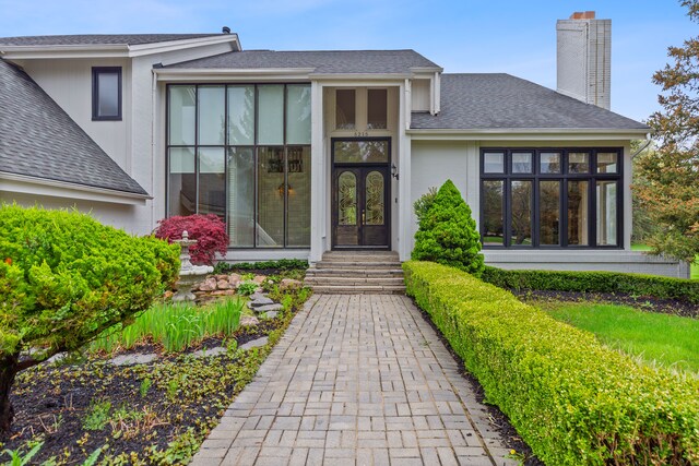 5215 Deer Run Cir, Orchard Lake, MI 48323 - entrance to property featuring french doors, a chimney, and a shingled roof
