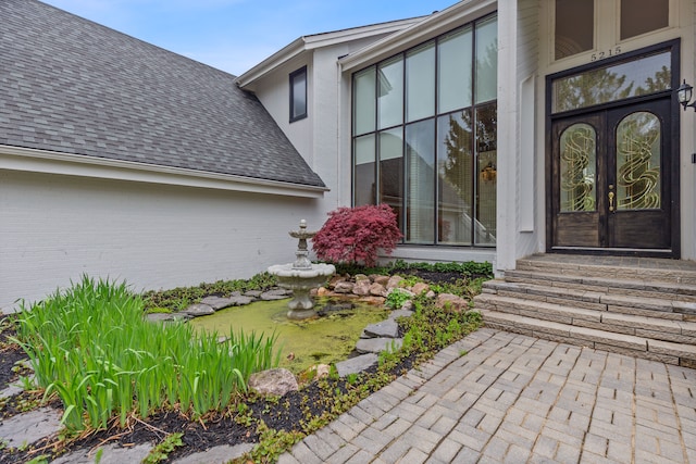 5215 Deer Run Cir, Orchard Lake, MI 48323 - view of exterior entry with a shingled roof and french doors