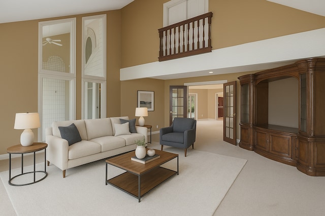 5215 Deer Run Cir, Orchard Lake, MI 48323 - living room with light colored carpet, a towering ceiling, and baseboards