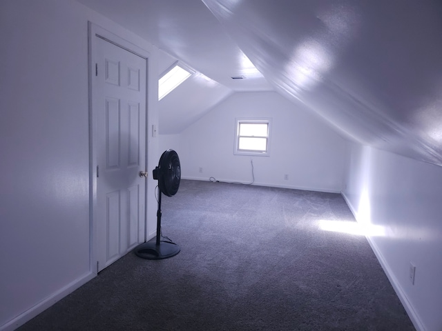 bonus room featuring carpet, vaulted ceiling, and baseboards