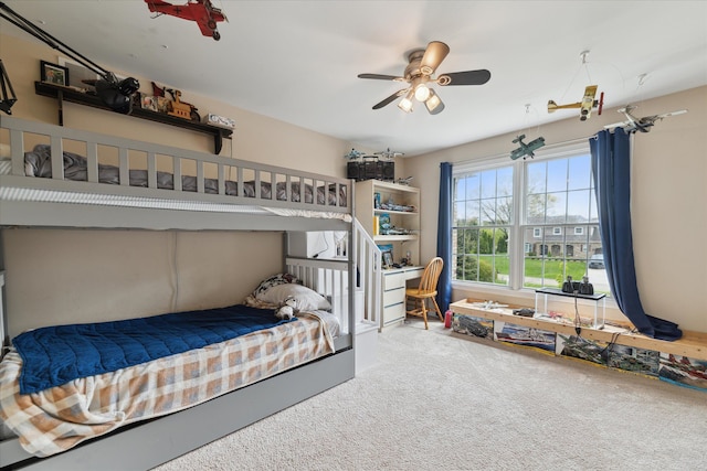 bedroom with carpet flooring and a ceiling fan