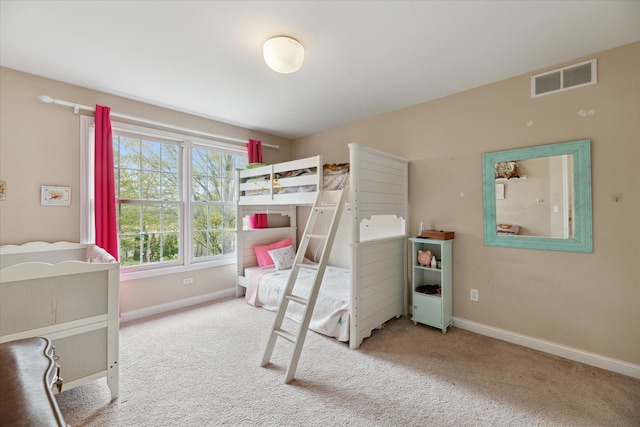 bedroom with baseboards and carpet flooring