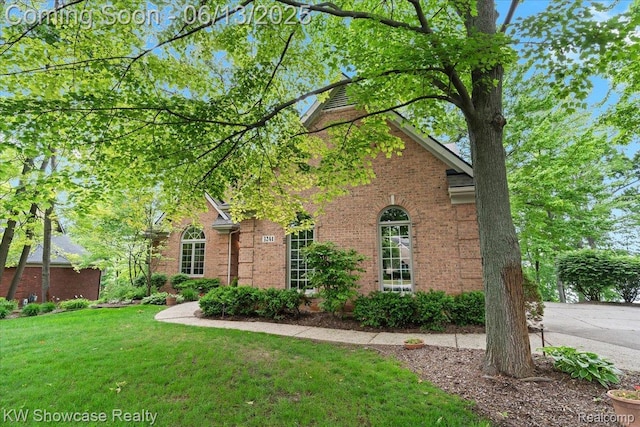3241 Governors Ln, Commerce Twp, MI 48390 - view of front of house with a front lawn and brick siding