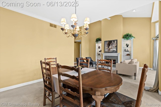 3241 Governors Ln, Commerce Twp, MI 48390 - carpeted dining area with a chandelier and a lit fireplace
