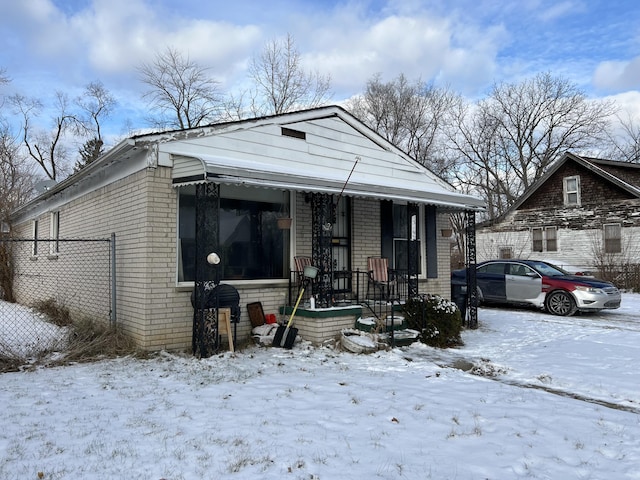 13192 Schoolcraft Rd, Detroit, MI 48227 - shotgun-style home with brick siding and fence
