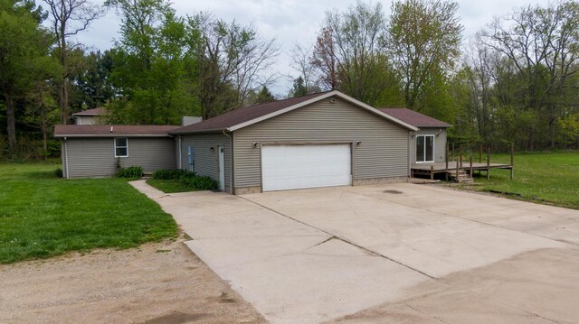 15105 Carpenter Rd, Three Oaks, MI 49128 - ranch-style home featuring a front yard, an attached garage, and a deck
