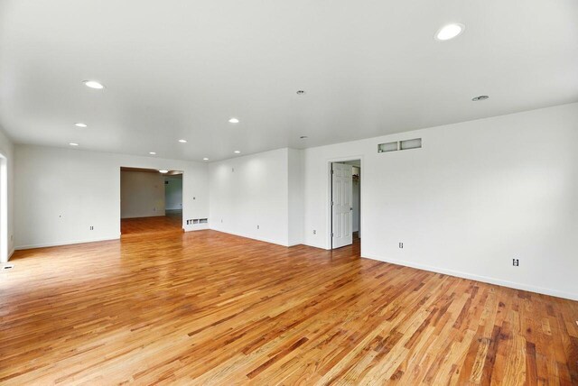 15105 Carpenter Rd, Three Oaks, MI 49128 - empty room with light wood-style flooring, recessed lighting, and baseboards