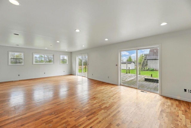 15105 Carpenter Rd, Three Oaks, MI 49128 - unfurnished living room featuring light wood-style flooring, baseboards, and recessed lighting