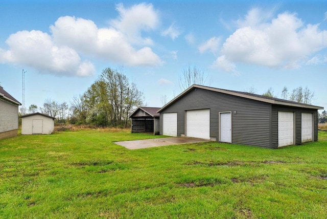 15105 Carpenter Rd, Three Oaks, MI 49128 - view of green lawn with an outbuilding and a detached garage