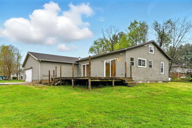 15105 Carpenter Rd, Three Oaks, MI 49128 - back of house with a deck, a yard, a garage, and driveway