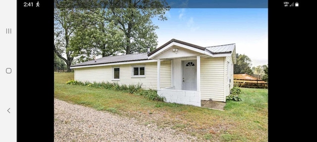 3350 Lacey Rd, Dowling, MI 49050 - bungalow featuring metal roof and a front yard