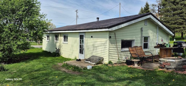 3350 Lacey Rd, Dowling, MI 49050 - back of house with a yard and metal roof