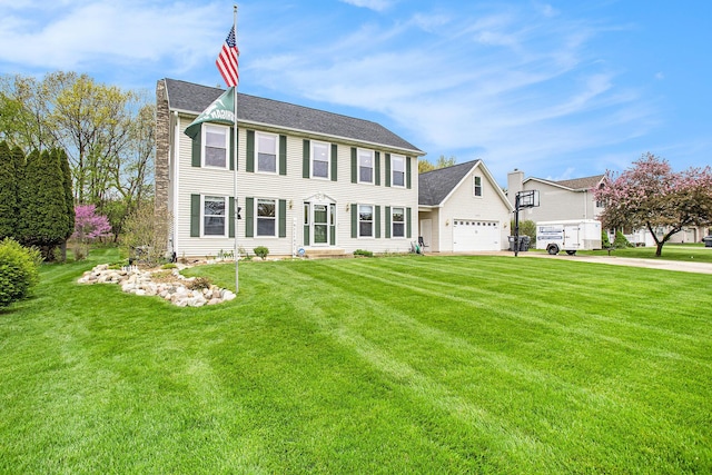 10420 Roger St, Portage, MI 49002 - colonial home with a front lawn, driveway, and a garage