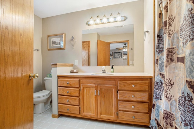 10420 Roger St, Portage, MI 49002 - full bath with toilet, tile patterned floors, vanity, ceiling fan, and a shower with curtain