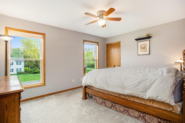 10420 Roger St, Portage, MI 49002 - carpeted bedroom featuring baseboards and ceiling fan