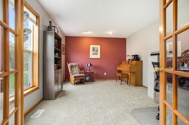 10420 Roger St, Portage, MI 49002 - living area featuring plenty of natural light, carpet, and baseboards