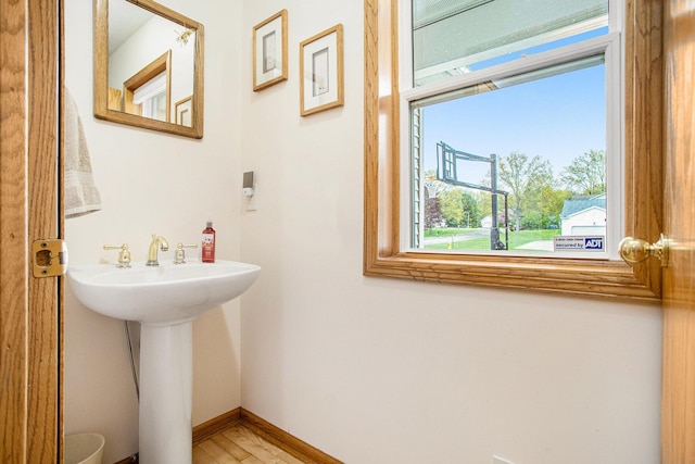10420 Roger St, Portage, MI 49002 - bathroom with baseboards and wood finished floors