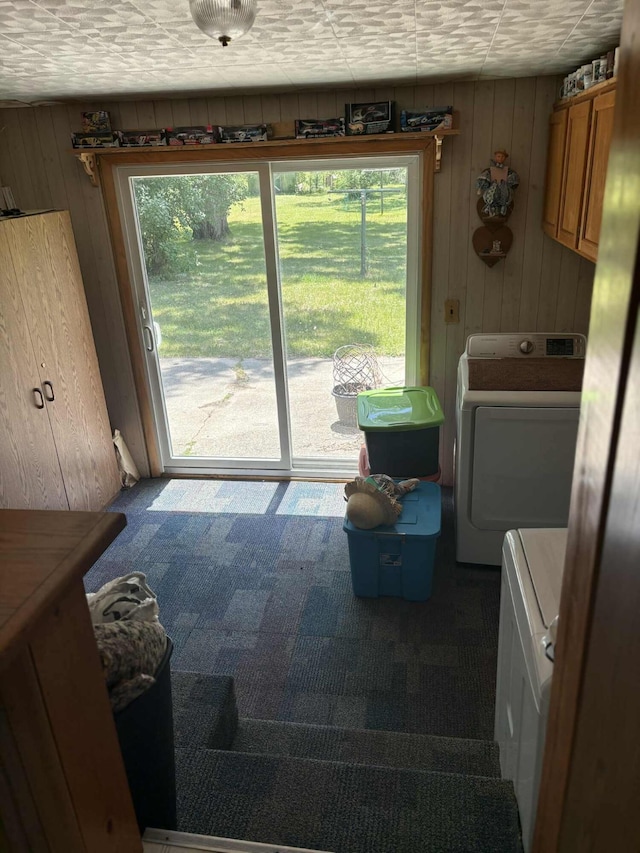 400 E Michigan Ave, Hesperia, MI 49421 - laundry area featuring carpet, wooden walls, cabinet space, and independent washer and dryer
