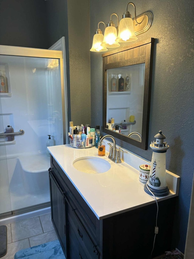 400 E Michigan Ave, Hesperia, MI 49421 - full bathroom featuring a shower, vanity, and a textured wall